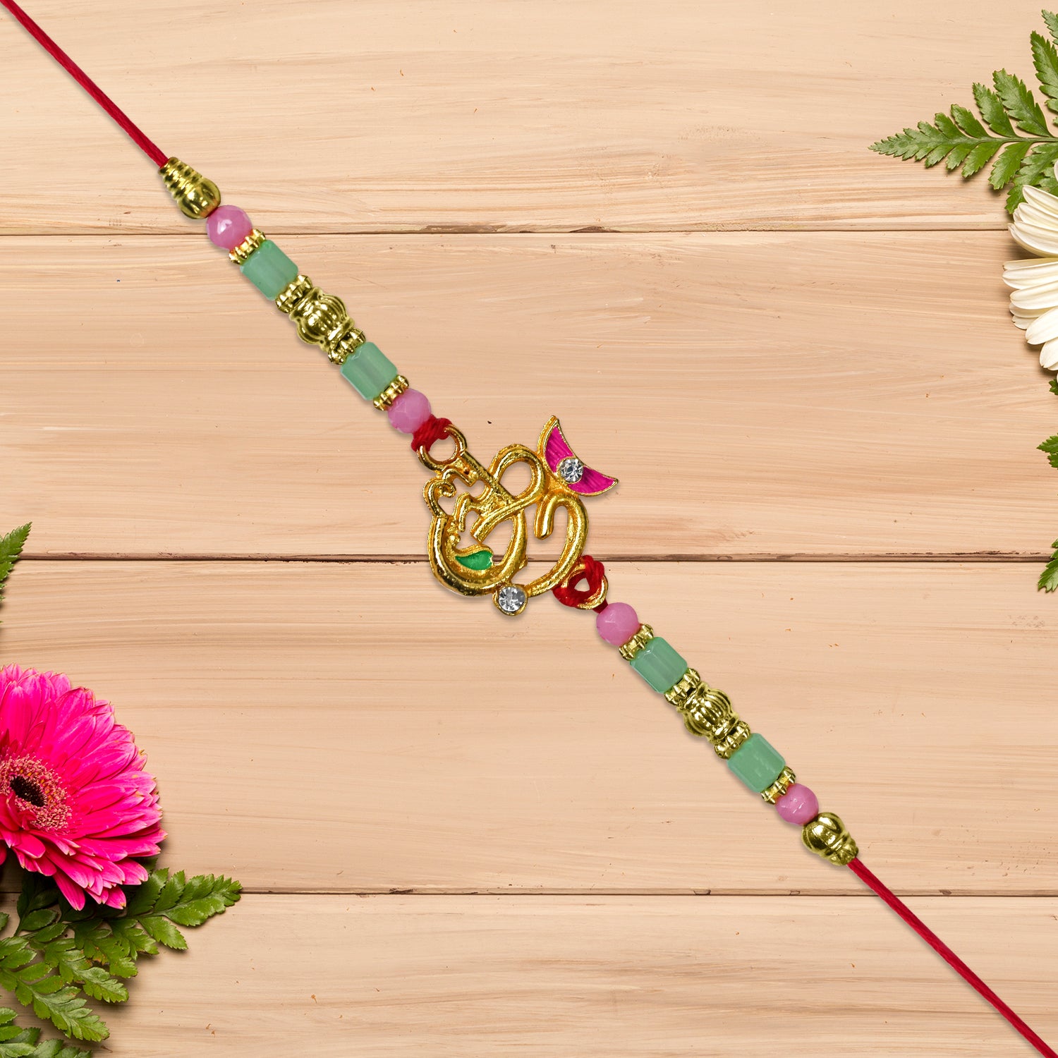 Om Moon Rakhi With Colorful Beads And Stones Om Moon Rakhi With Colorful Beads And Stones